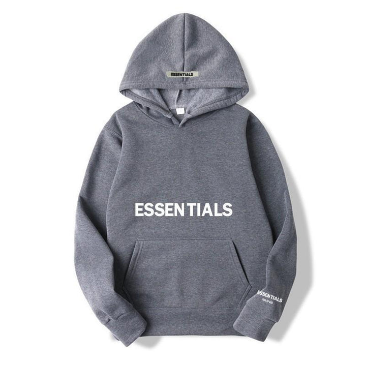 Close-up of letter print on a cozy unisex pullover hoodie, perfect for casual street style.