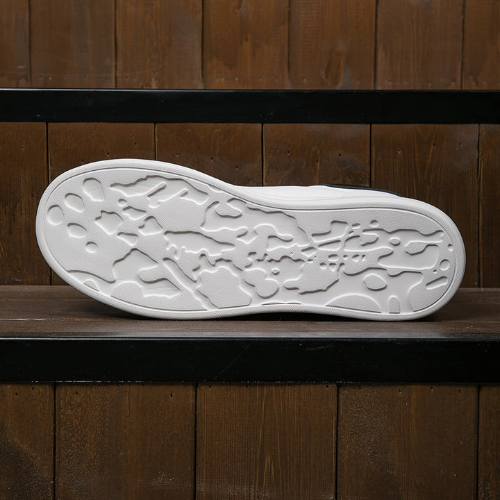Flexible outsole of lightweight unisex orthopedic sneakers, promoting natural foot movement and comfort.