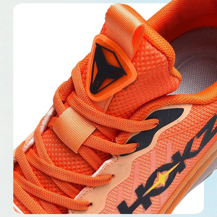 Secure lacing system on unisex running shoes, delivering a supportive fit for performance jogging.