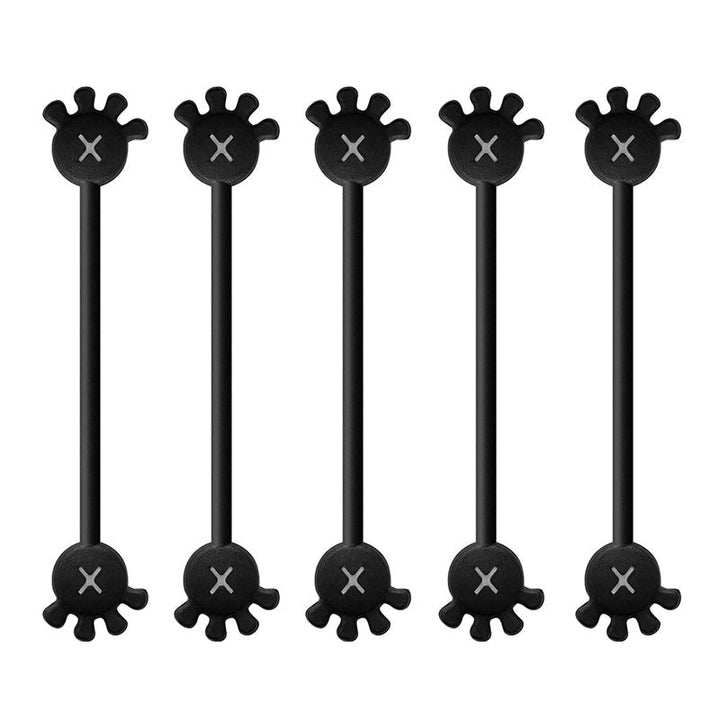 Desk setup featuring a laptop and various tech accessories organized with magnetic silicone clips.