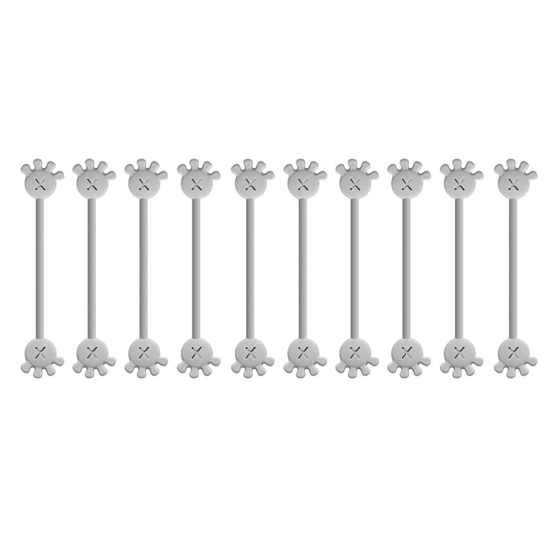 Hand placing a charging cable into an open magnetic silicone cable organizer clip, ease of use.