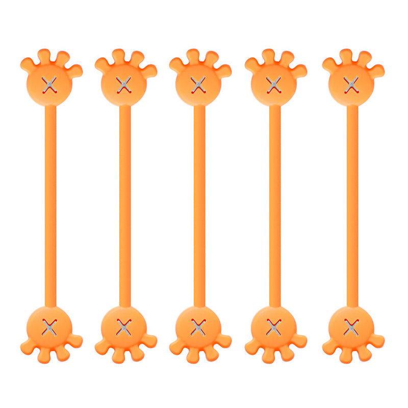 Multiple magnetic silicone cable organizer clips holding various power cords and USB cables neatly.