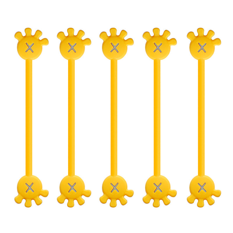 Magnetic silicone cable organizer clip, sky blue, tidying up a messy collection of phone chargers.