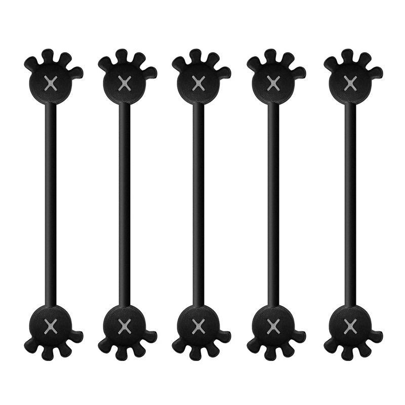 Overhead shot of desk with magnetic silicone cable organizer clip keeping a mouse cable in place.