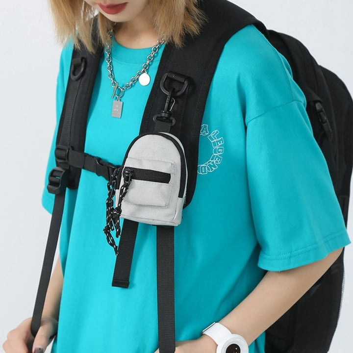 Small black unisex pendant bag, a practical utility pouch for travel.