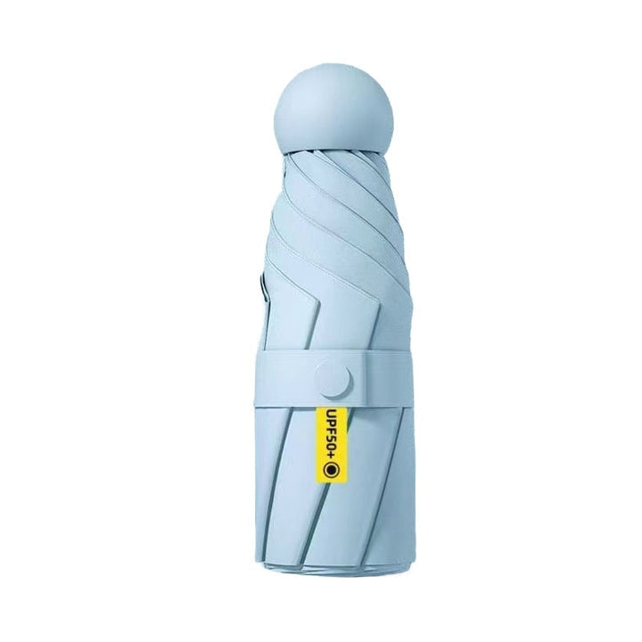 Overhead shot of an open unisex mini portable travel umbrella, full coverage for one