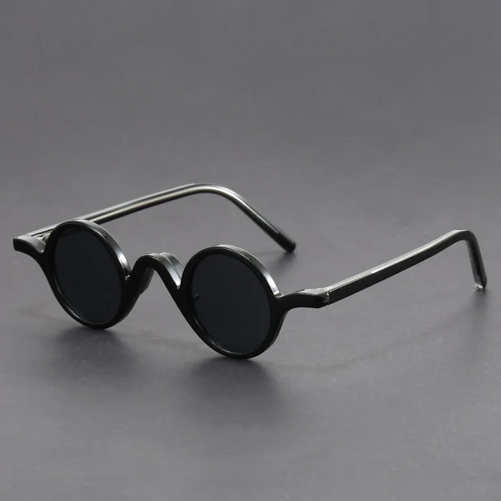 Unisex modern round frame sunglasses with full UV protection, stylish and contemporary eyewear accessory.