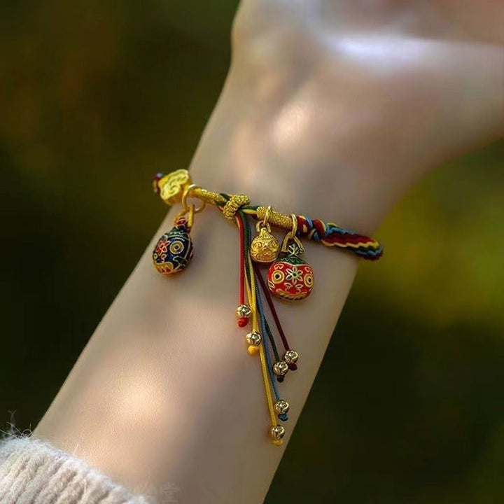 Stack of multiple Mythical Reincarnation Cord Bracelets in different colors, unisex & ethnic