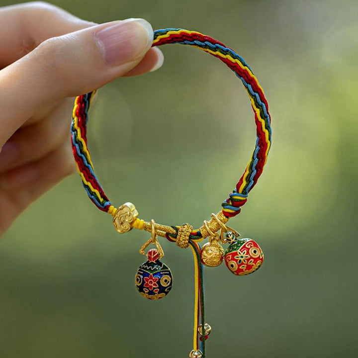 Detail of the cord and mythological charm on the Reincarnation bracelet, unisex design