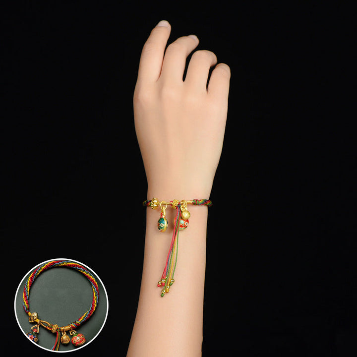 Overhead shot of a full length Mythical Reincarnation cord bracelet, unique & unisex