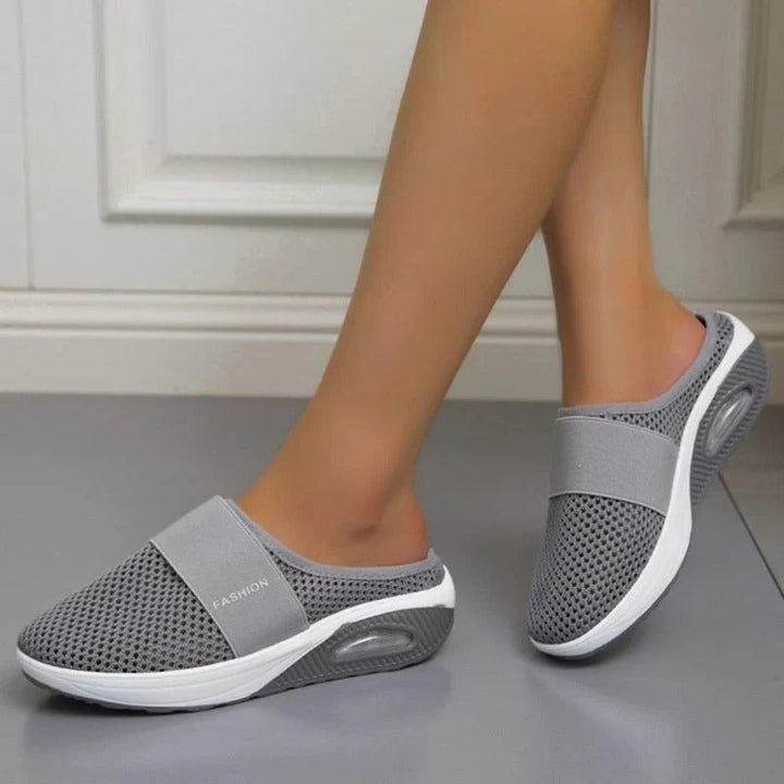 Unisex orthopedic comfort slippers for daily support. Ergonomic design, foot pain relief, breathable & lightweight.