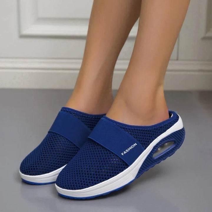 Lightweight, breathable slip-on unisex slippers with ergonomic design and orthopedic comfort for daily support.