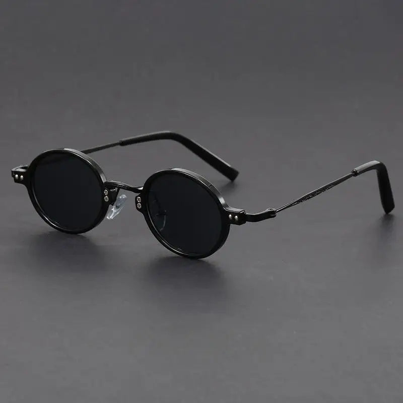 Close-up of unisex vintage oval sunglasses, highlighting the precision craftsmanship and sleek design.
