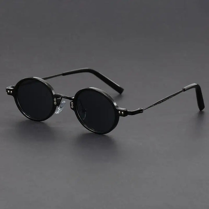Close-up of unisex vintage oval sunglasses, highlighting the precision craftsmanship and sleek design.