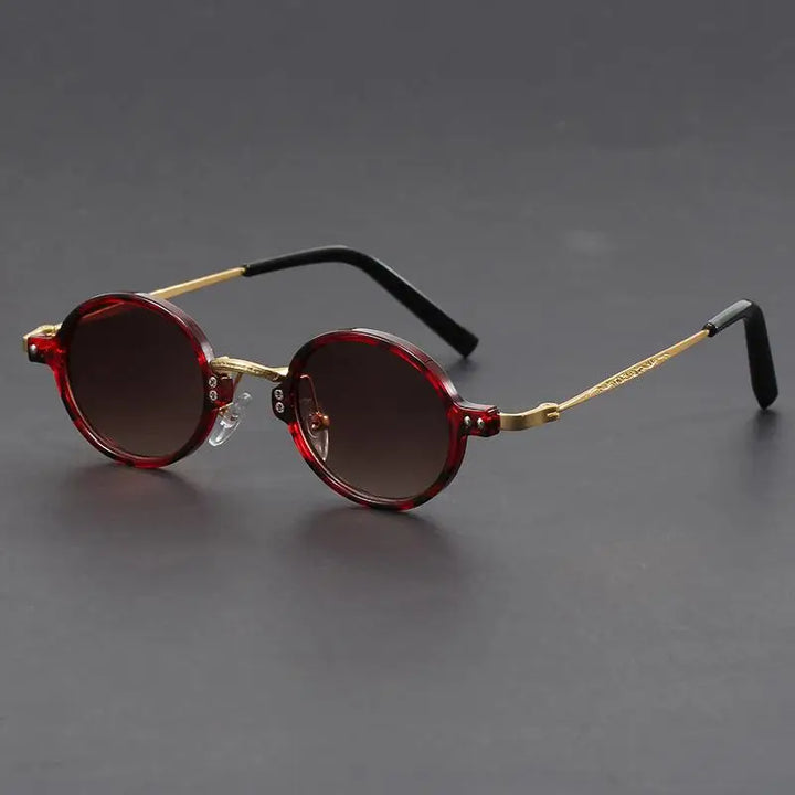 Unisex oval sunglasses, a vintage-inspired fashion accessory combining precision and timeless style.