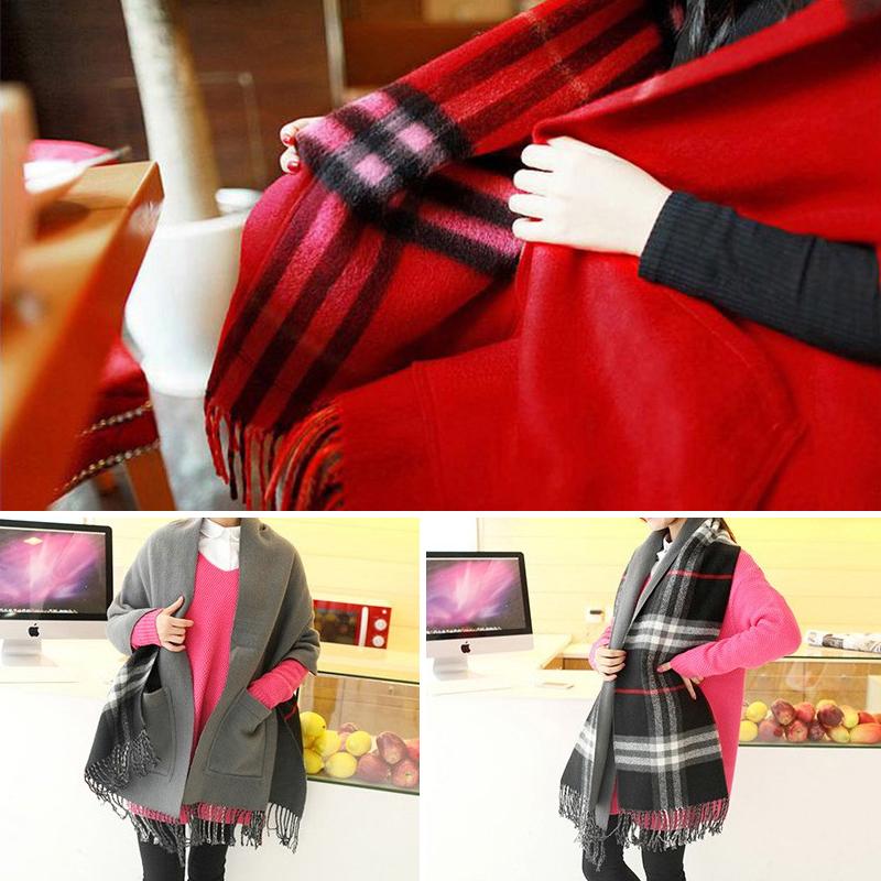 Unisex plaid shawl acting as a comfort wrap, with pockets, against a rustic winter background