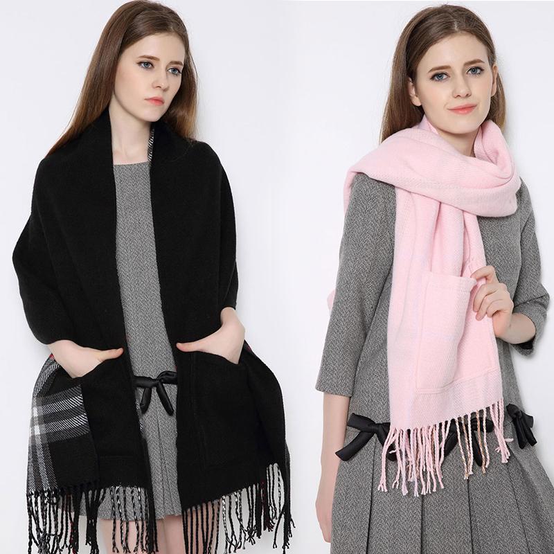 Studio shot of a unisex plaid wrap shawl with deep pockets, emphasizing its warmth and quality feel