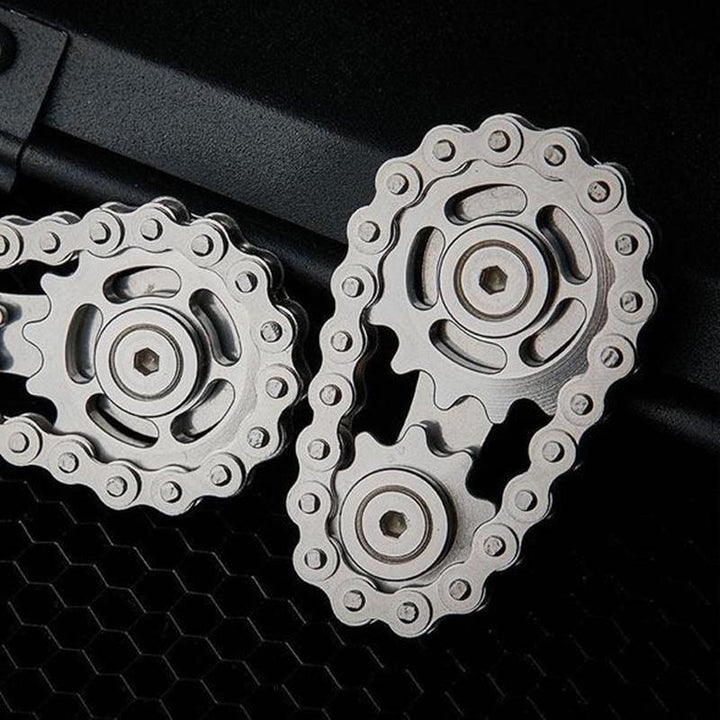 Portable gyro fidget sprocket toy in shiny stainless steel, ideal for focus and anxiety