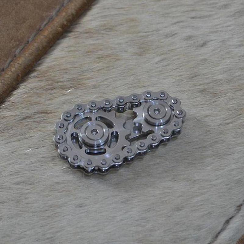 Action shot of the precision fidget sprocket toy spinning, showcasing its smooth rotation