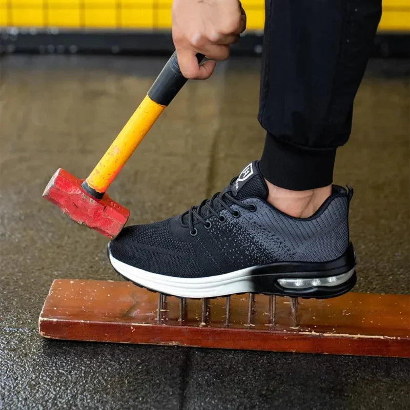 Black protective safety sneakers featuring air cushion sole and robust industrial protection.