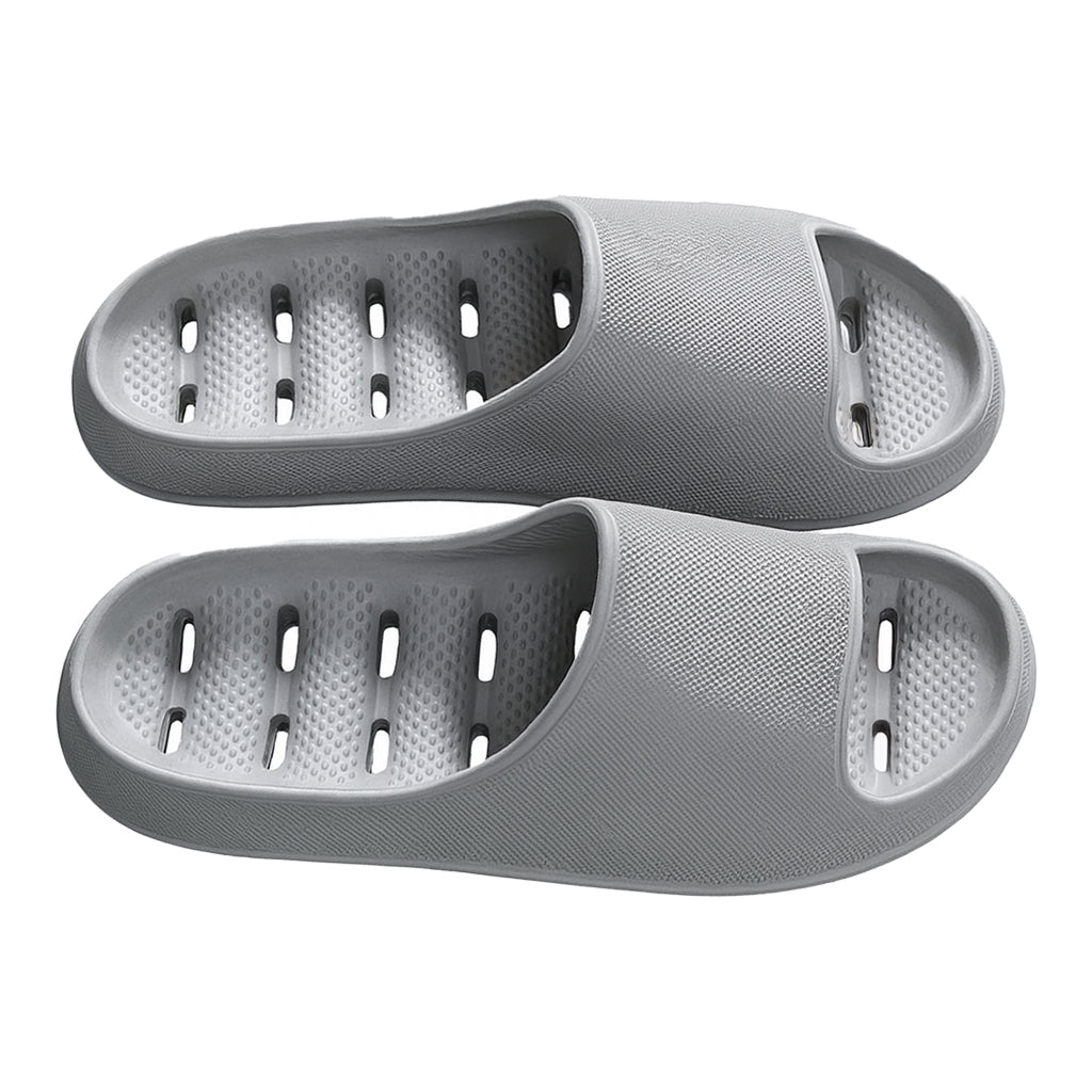 Close-up of quick-dry shower slippers showing effective drainage holes & waterproof design for wet environments.