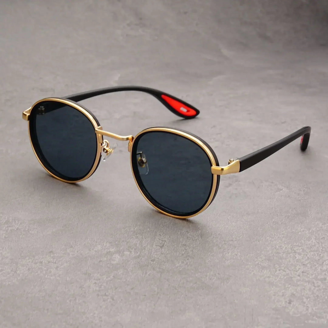 Close-up of vintage-style round metal sunglasses, a fashionable unisex eyewear accessory