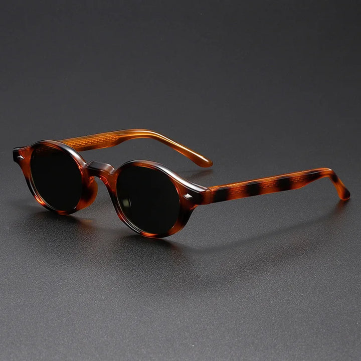 Pair of retro round sunglasses for men and women, amber frames, offering UV protection.