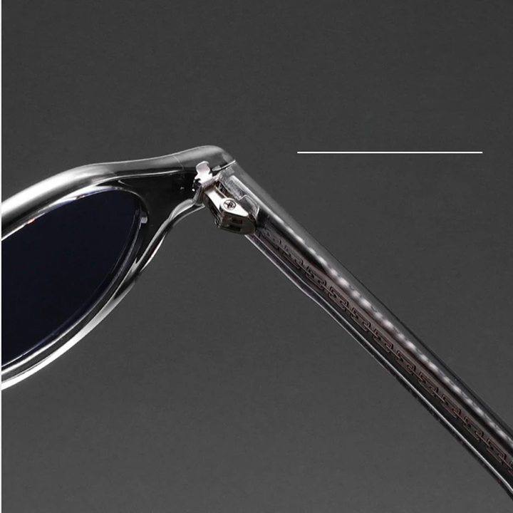 Stylish unisex round eyewear, amber frames, showcasing retro fashion and UV protection.