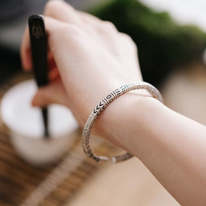 Stack of unisex retro totem ethnic bangle bracelets, showing adjustable copper jewelry
