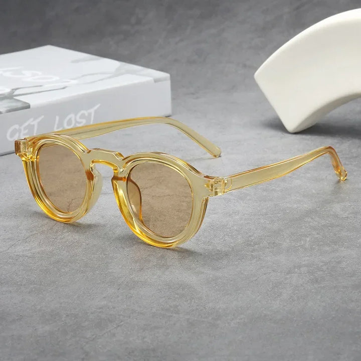 Fashionable tortoise frame round sunglasses, unisex, with tinted lenses.