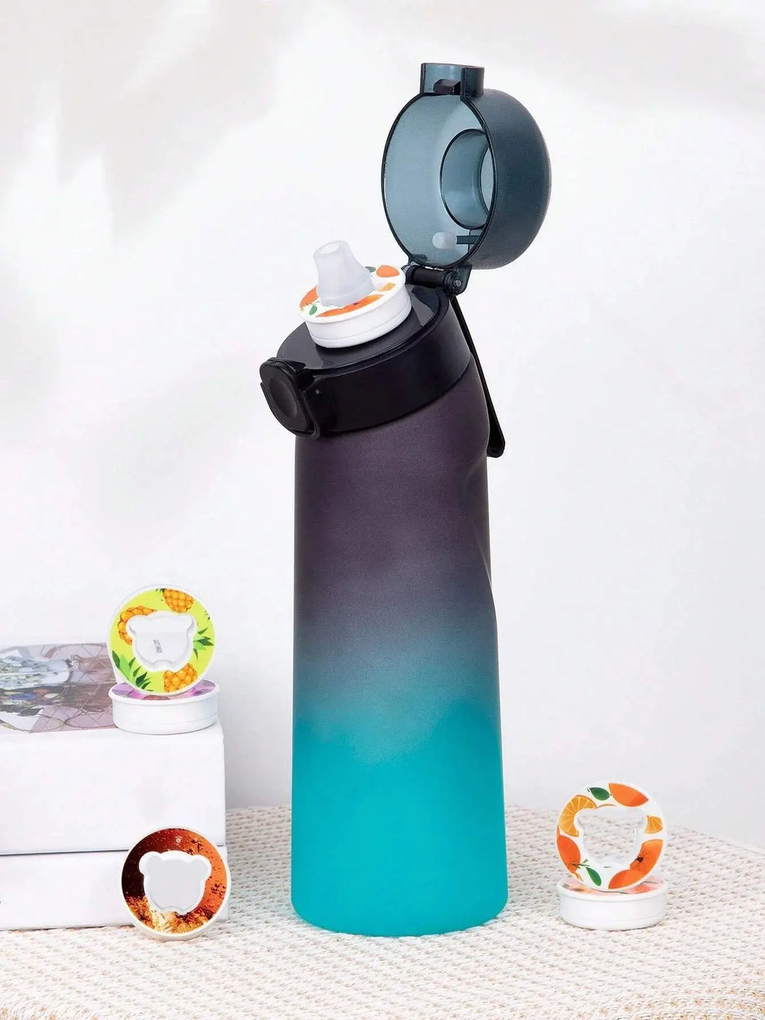 Reusable 0.65L flavored water bottle with scent pods for healthy, guilt-free drinking.