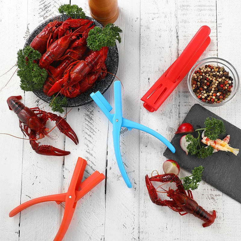 Single red plastic Seafood Sheller Tool, a must-have dining accessory for seafood lovers