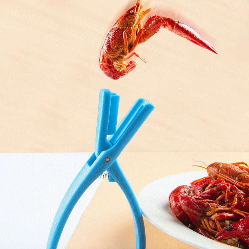 Top-down view of a red plastic Seafood Sheller Tool, essential for easy clean seafood peeling