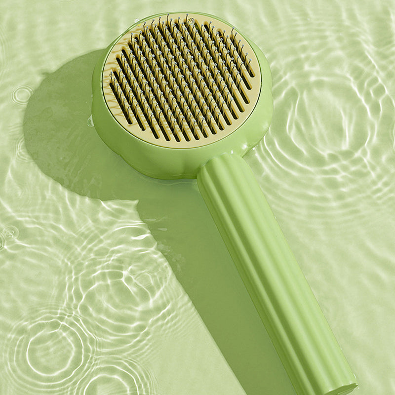 Side view of the Self-Cleaning Pet Brush, displaying its ergonomic handle and sturdy ABS plastic build