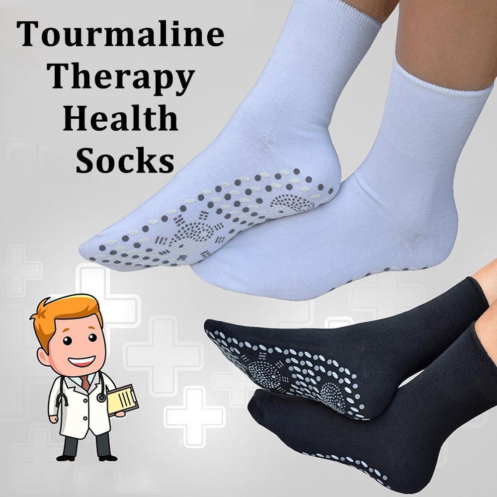 Pair of black self-heating tourmaline socks, designed to provide foot comfort and anti-fatigue benefits.