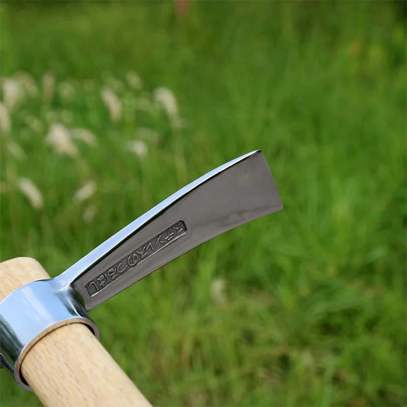 Ergonomic wood handle of the mattock & pickaxe combination, showing the secure attachment to the steel head.
