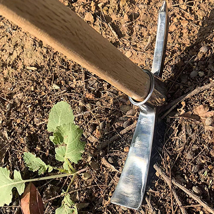 Unisex outdoor gear: A shiny stainless steel mattock with a sturdy wooden grip, ready for heavy-duty use.