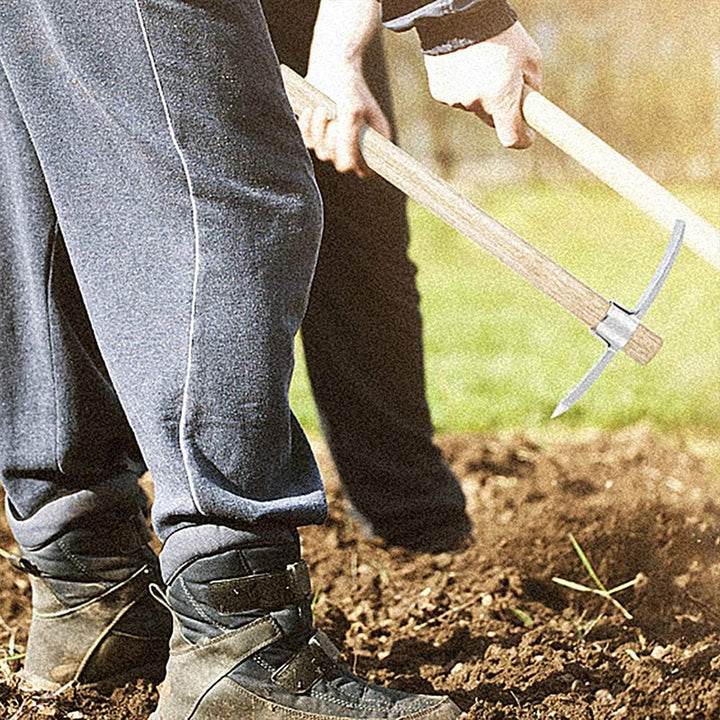 Detail of the pointed pickaxe end and broad mattock blade, crafted from high-quality stainless steel.