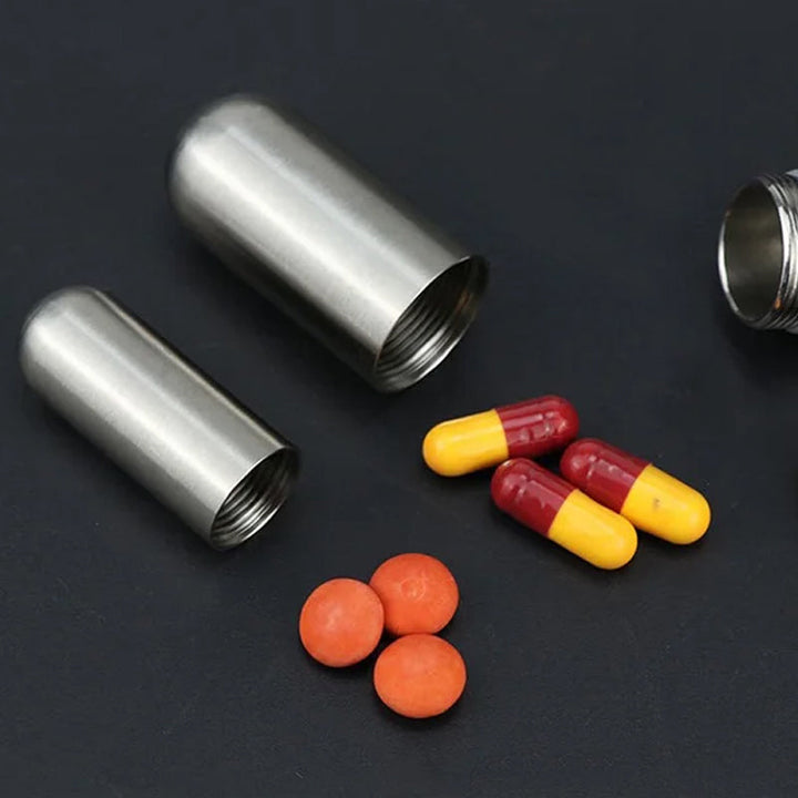 Unisex stainless steel waterproof pill box, ideal for daily medication storage and travel