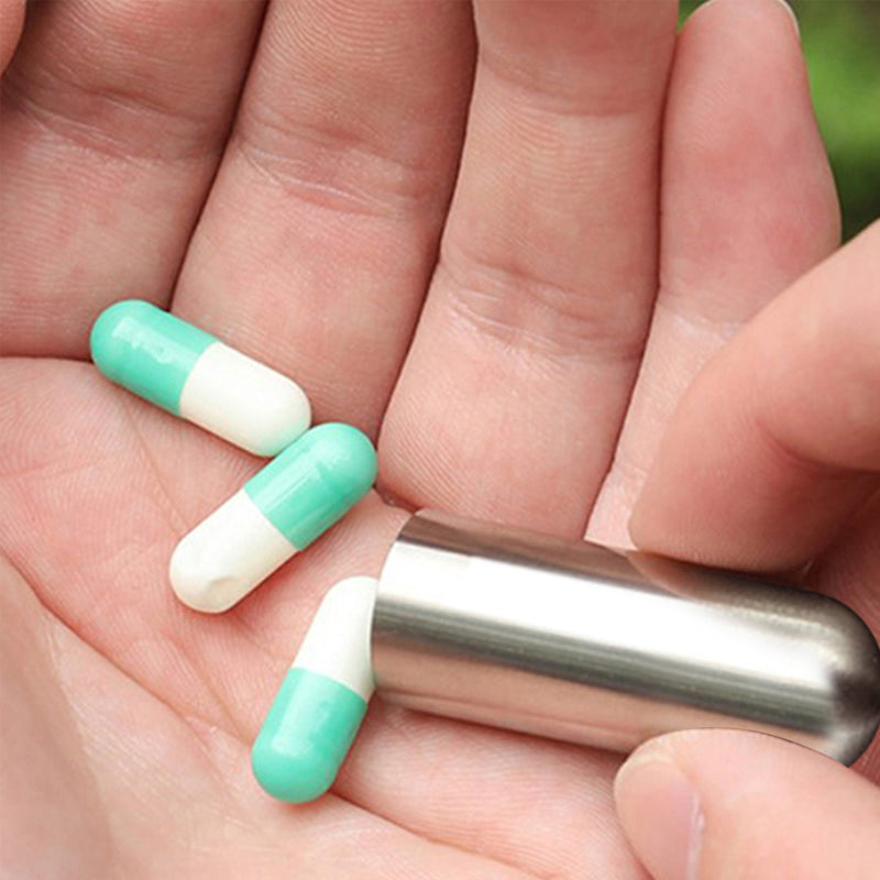 Multiple stainless steel waterproof pill boxes arranged, highlighting their compact design