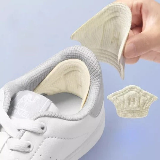 Cushioned black & beige sweat-resistant heel grips for anti-slip foot support & secure shoe fit.