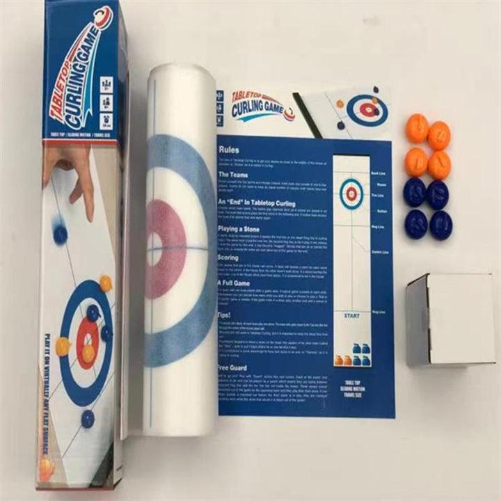 Detailed shot of the Tabletop Curling Game's smooth gliding stones and durable game mat.