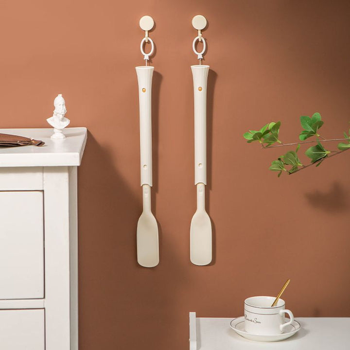 Ergonomic handle of a long shoe horn, designed for comfortable grip & daily living assistance