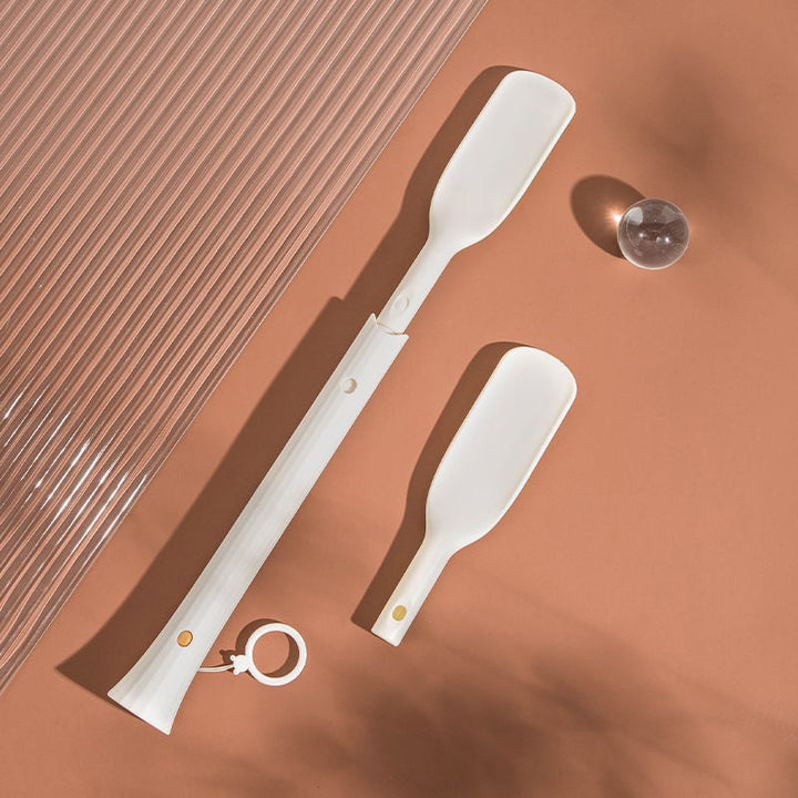 Close-up of the shoe horn's tip, illustrating its smooth curve for effortless shoe entry