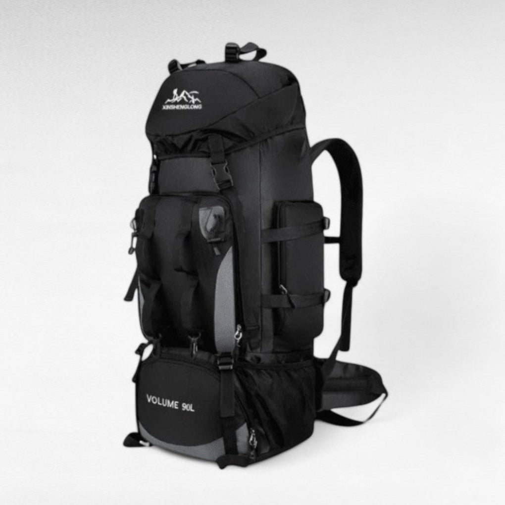 Spacious 90L waterproof camping backpack in forest. Unisex travel pack for long hikes, adventure, & outdoor gear.