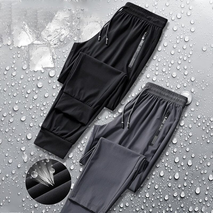 Unisex black stretch pants, quick dry fabric ideal for active lifestyles and everyday wear