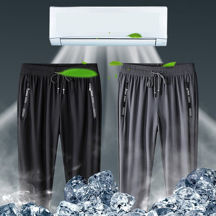 Unisex stretch athletic pants in navy, featuring a quick dry material for active comfort