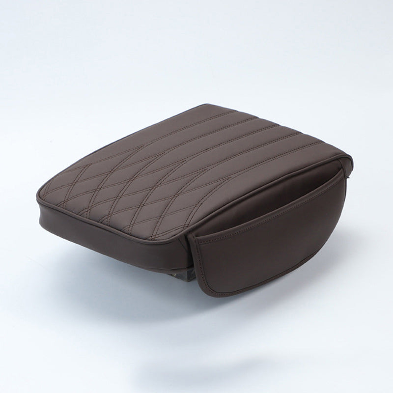 Brown leather car armrest cushion, universal, blending with various car interiors for style and comfort.