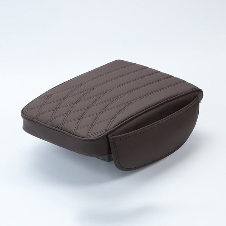 Brown leather car armrest cushion, universal, blending with various car interiors for style and comfort.