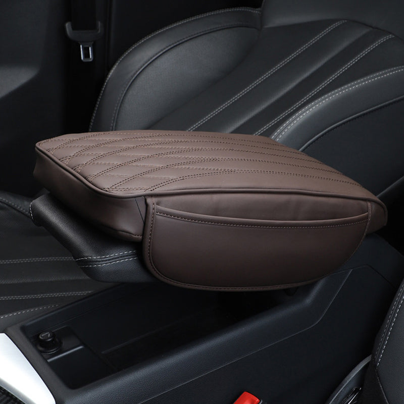 Ergonomic car armrest cushion in leather, designed for universal fit and ultimate driving comfort.